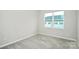 Bedroom with neutral carpet with a window allowing natural light at 1270 Brawley School Rd # E, Mooresville, NC 28177