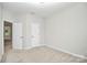 Bedroom with neutral carpet and 2 doors at 1270 Brawley School Rd # E, Mooresville, NC 28177