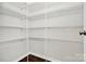 Walk-in closet featuring white wire shelving for ample storage space at 1270 Brawley School Rd # E, Mooresville, NC 28177