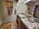 Bathroom featuring a large mirror, unique countertops, and marble floors at 1359 Carmen Ln, Gastonia, NC 28054