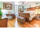 Charming bedroom featuring hardwood floors, vintage furniture, and ample natural light at 1359 Carmen Ln, Gastonia, NC 28054