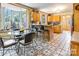 Cozy breakfast nook with bay window, counter seating, and decorative flooring at 1359 Carmen Ln, Gastonia, NC 28054