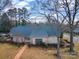 A brick single-Gathering home with a brick walkway and mature trees in the front yard at 1359 Carmen Ln, Gastonia, NC 28054