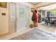 Inviting foyer featuring tile flooring, decorative glass door, and a view into the elegant dining room at 1359 Carmen Ln, Gastonia, NC 28054