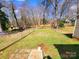 Fenced backyard with a lush lawn and easy access to the home and back patio at 1377 S Aspen St, Lincolnton, NC 28092