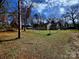 Fully fenced backyard perfect for privacy, with a lush lawn and convenient access to the home at 1377 S Aspen St, Lincolnton, NC 28092