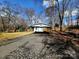 Covered carport with additional storage providing protection for your vehicle from the elements at 1377 S Aspen St, Lincolnton, NC 28092