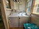 Bright laundry room features a side-by-side washer and dryer set at 1377 S Aspen St, Lincolnton, NC 28092