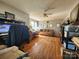 Sun-drenched living room with hardwood floors, a cozy sofa, and large windows at 1377 S Aspen St, Lincolnton, NC 28092