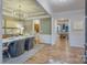 Tastefully decorated dining area showcases stylish chandelier and leads into a comfortable living space at 13935 Penbury Ln # 378, Charlotte, NC 28278
