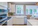 Well-designed kitchen featuring stainless steel appliances, ample counter space, and a bright window at 13935 Penbury Ln # 378, Charlotte, NC 28278