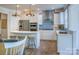 Bright and airy kitchen featuring stainless steel appliances, island seating, and stylish pendant lighting at 13935 Penbury Ln # 378, Charlotte, NC 28278