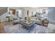 Comfortable living room featuring an inviting sofa and stylish decor, perfect for relaxing and entertaining at 13935 Penbury Ln # 378, Charlotte, NC 28278