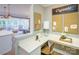 Bright home office with a white desk, bulletin boards, modern chair, and views to the living room at 13935 Penbury Ln # 378, Charlotte, NC 28278