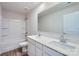 Bright bathroom featuring double sinks, white cabinets, quartz countertop, and tub/shower combination at 1402 Pine Heart Dr, Edgemoor, SC 29712