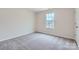 Simple bedroom with neutral walls, carpet, and a bright window at 1402 Pine Heart Dr, Edgemoor, SC 29712