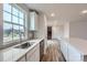 Bright kitchen featuring white cabinets, stainless steel appliances, and a quartz countertop at 1402 Pine Heart Dr, Edgemoor, SC 29712