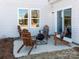 Relaxing patio with wood adirondack chairs and fire pit, perfect for outdoor entertaining at 167 Shepherds Landing Dr, Mooresville, NC 28115