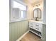 Updated bathroom featuring an elegant mirror, attractive sink, and nice natural light at 1770 Windsor Dr, Lancaster, SC 29720