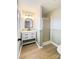 Updated bathroom featuring an elegant mirror, modern sink, and tiled shower with glass door at 1770 Windsor Dr, Lancaster, SC 29720