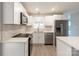 Bright kitchen with modern stainless steel appliances and crisp white cabinets at 1770 Windsor Dr, Lancaster, SC 29720