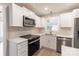 Well-appointed kitchen featuring stainless steel appliances, quartz countertops and a spacious layout at 1770 Windsor Dr, Lancaster, SC 29720