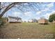 Expansive backyard featuring storage shed and ample space for recreation and gardening at 1893 Hilltop Cir, Gastonia, NC 28054