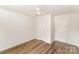 Bedroom showing wood-look flooring and two closet doors at 1893 Hilltop Cir, Gastonia, NC 28054