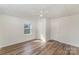 Bedroom featuring neutral walls, wood-look flooring, a window, and two closets at 1893 Hilltop Cir, Gastonia, NC 28054