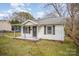 Adorable one-story home with a welcoming covered porch and shuttered windows at 1893 Hilltop Cir, Gastonia, NC 28054