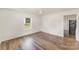 Bright living room with vinyl flooring and natural light streaming through the window at 1893 Hilltop Cir, Gastonia, NC 28054