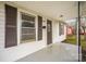 Close-up on front porch with a painted concrete surface, showing the home's number and features at 1893 Hilltop Cir, Gastonia, NC 28054