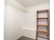 This walk-in closet has wire shelving and carpet at 1911 Woodlawn St, Kannapolis, NC 28083