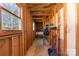 Under construction hallway, with wooden framing that creates a unique look and a glimpse into the future design at 1911 Woodlawn St, Kannapolis, NC 28083