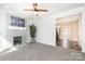 Cozy living room with a painted fireplace, complemented by an open layout into the kitchen at 1911 Woodlawn St, Kannapolis, NC 28083