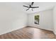 Bedroom features wood floors, ceiling fan, and a window with a view at 1915 Kingston Dr, Gastonia, NC 28052