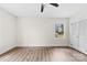 Bedroom showcasing wood floors, white trim, and a ceiling fan at 1915 Kingston Dr, Gastonia, NC 28052