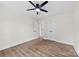 Bedroom featuring wood floors, ceiling fan, and double door closet at 1915 Kingston Dr, Gastonia, NC 28052