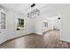 Bright dining room with large window, wood floors, and decorative lighting at 1915 Kingston Dr, Gastonia, NC 28052