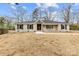 Inviting single story home with black shutters, brick exterior, and a neatly kept front lawn at 1915 Kingston Dr, Gastonia, NC 28052