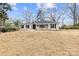 Charming one-story brick home with dark shutters, fresh landscaping, and blue skies at 1915 Kingston Dr, Gastonia, NC 28052