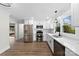 Modern kitchen with white cabinets, stainless steel appliances, and quartz countertops at 1915 Kingston Dr, Gastonia, NC 28052