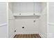 Functional laundry room with storage cabinets, peg board and wash basin hookups at 1915 Kingston Dr, Gastonia, NC 28052