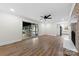 Spacious living room with access to screened in porch and view of the modern kitchen at 1915 Kingston Dr, Gastonia, NC 28052