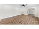 Minimalist living room with wood floors, white walls, and recessed lighting at 1915 Kingston Dr, Gastonia, NC 28052