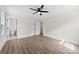 Bedroom featuring wood-look floors, ceiling fan, and en suite bathroom at 1915 Kingston Dr, Gastonia, NC 28052