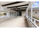 Spacious porch with brick base, white railings, and a fan overhead at 1915 Kingston Dr, Gastonia, NC 28052