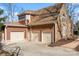 Attached three-car garage with ample parking space and neutral doors to blend with the exterior at 20338 Christofle Dr, Cornelius, NC 28031