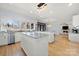 Open-concept kitchen with granite counters, a center island, and stainless steel appliances at 20338 Christofle Dr, Cornelius, NC 28031