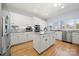 Open kitchen with stainless steel appliances and granite countertops at 20338 Christofle Dr, Cornelius, NC 28031